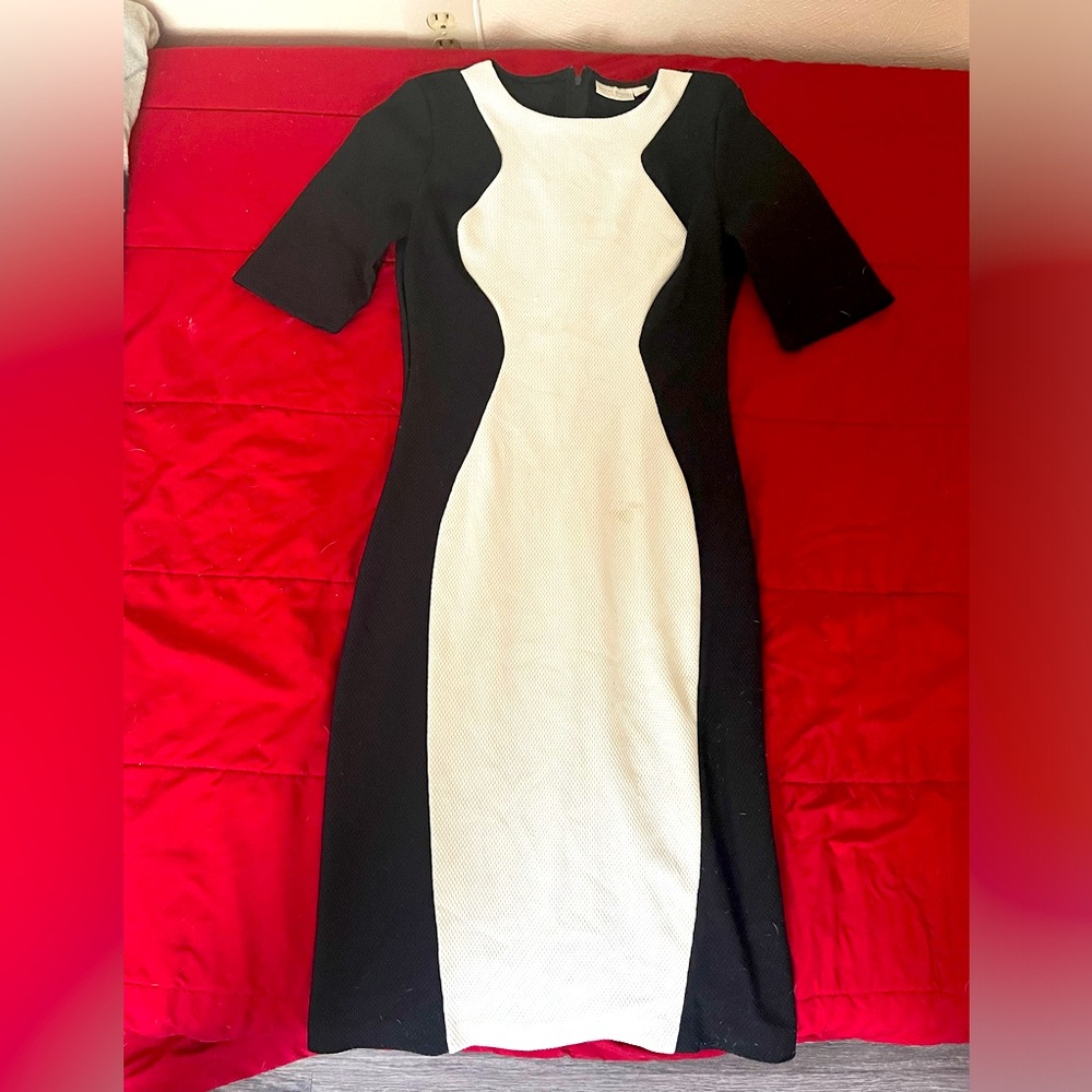 Black and white women's tuxedo dress